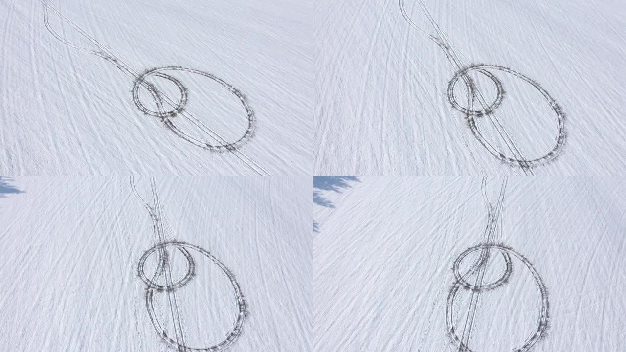 在下雪的山上飞行，轮胎步道4k无人机视频