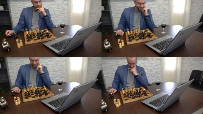 男子在笔记本电脑上使用视频会议与朋友下棋
