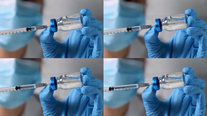 护士用疫苗填充注射器，用于从空白玻璃瓶中接种疫苗