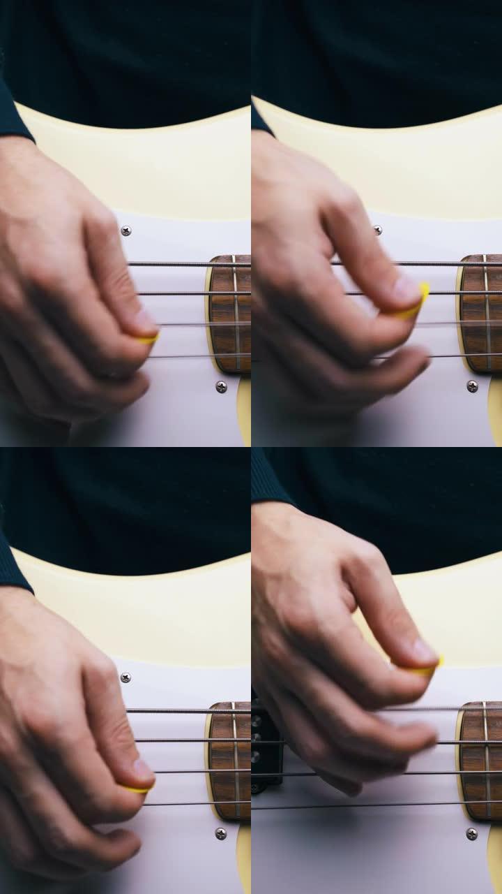 黄色拾音器的人展示低音吉他演奏技巧