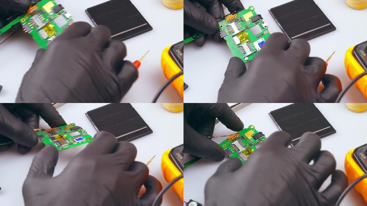 技术人员用测试仪修理电子设备。