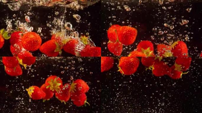 漂浮在水中的草莓的详细拍摄。彩色浆果以慢动作沉入液体中。