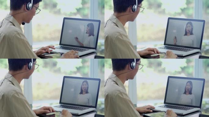 教育学习在线概念，亚洲青少年学生戴耳机使用计算机在线学习。新常态风格。