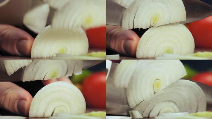 经验丰富的厨师用钢刀将洋葱切成薄片