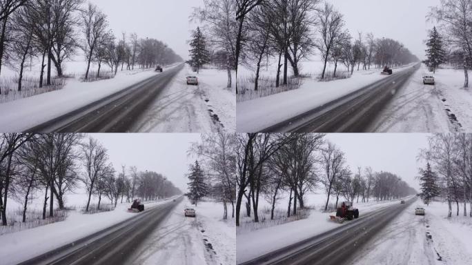 吹雪机平地机清除积雪覆盖的乡村道路鸟瞰图。