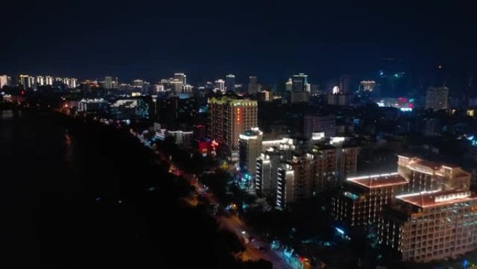 夜间照明海南岛三亚湾酒店空中全景4k中国