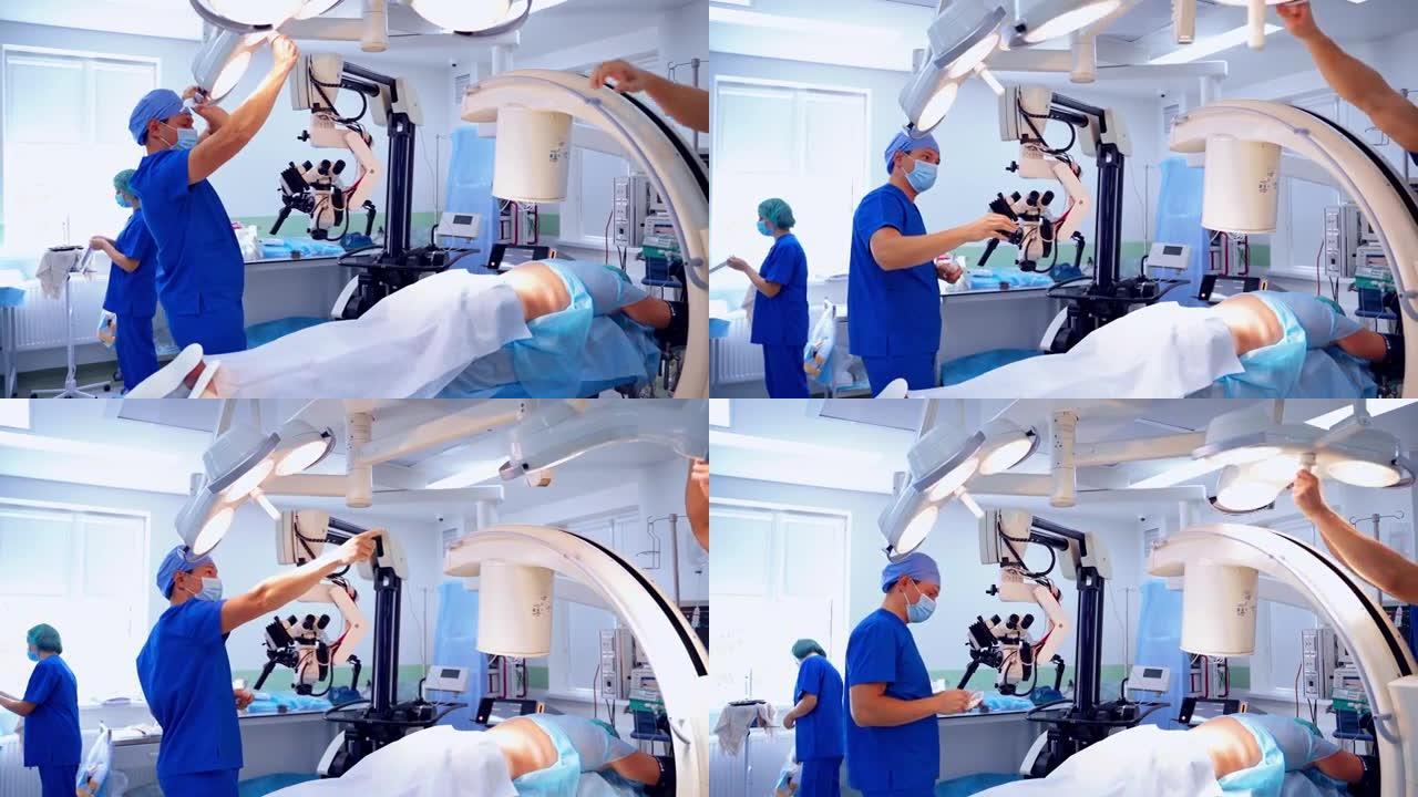 诊所的现代手术室。医生在手术前准备医疗设备。专家为操作定制电灯。