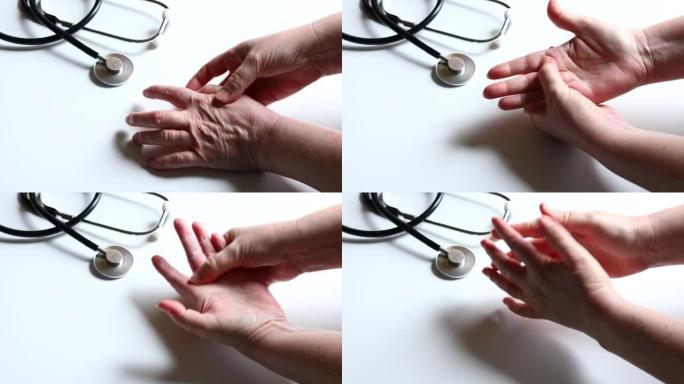 女人看着抓痒的手，患有严重的湿疹，特应性皮炎。皮肤皲裂的红色