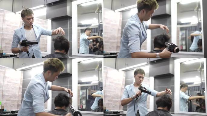 亚洲中国理发师，在他的沙龙里晒女人的头发。
