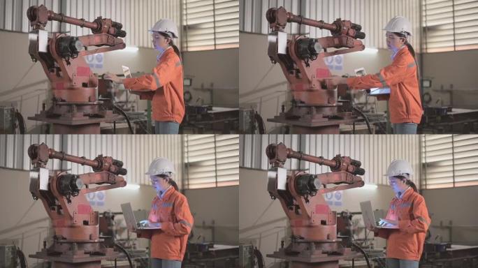 女性工程师通过平板电脑检测系统软件控制和监控智能汽车行业中手臂的自动焊接。