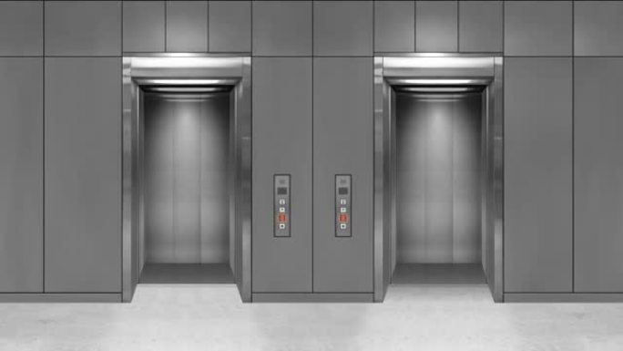 滑动钢门电梯打开，显示电梯内部。灰色墙壁的办公楼。