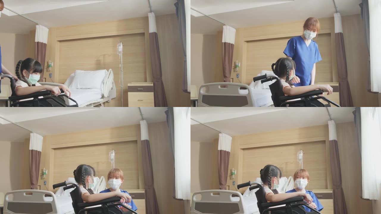 亚洲擦洗制服护士在医院康复室照顾坐在轮椅上的女童病人。戴着外科口罩保护covid 19大流行的年轻妇