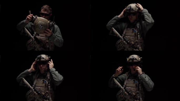 美国特种部队士兵在黑暗中戴上头盔