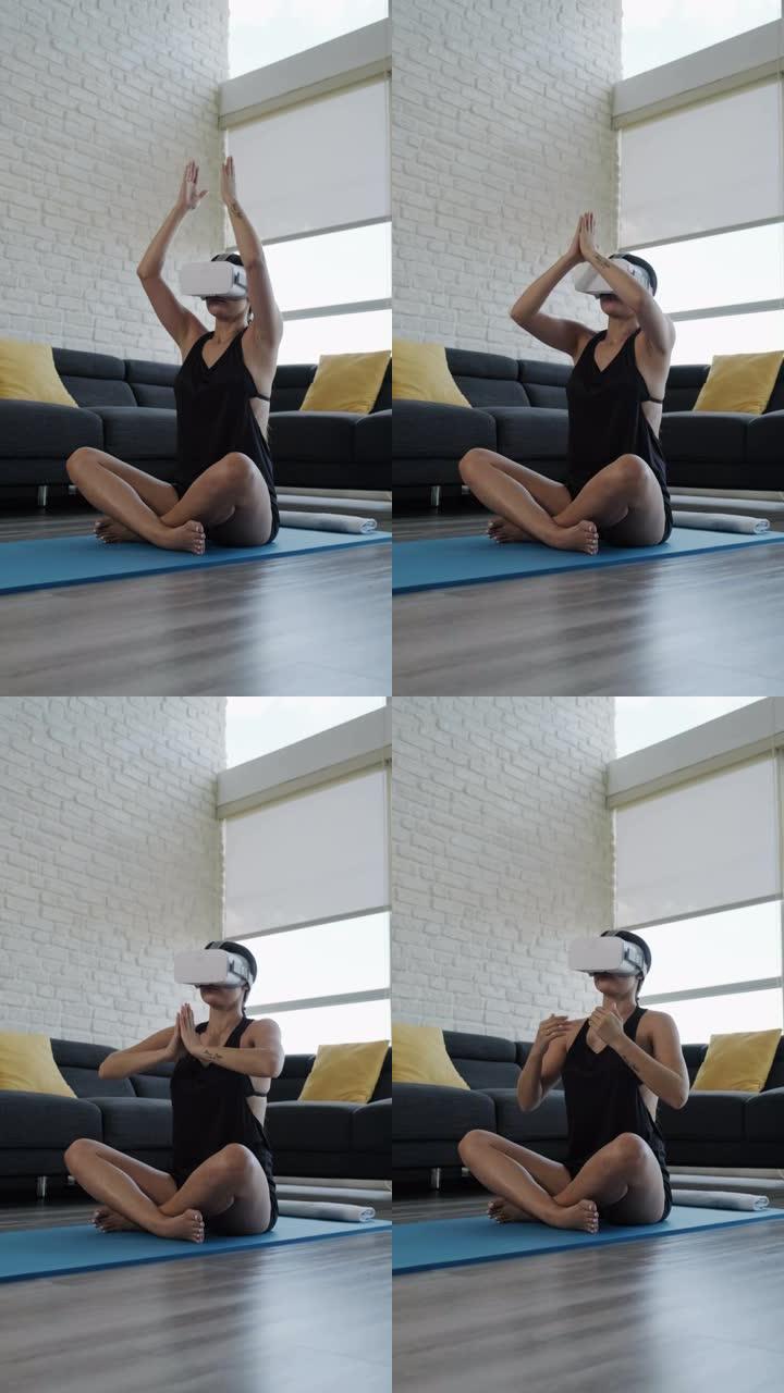 用虚拟现实耳机垂直做瑜伽的年轻女子