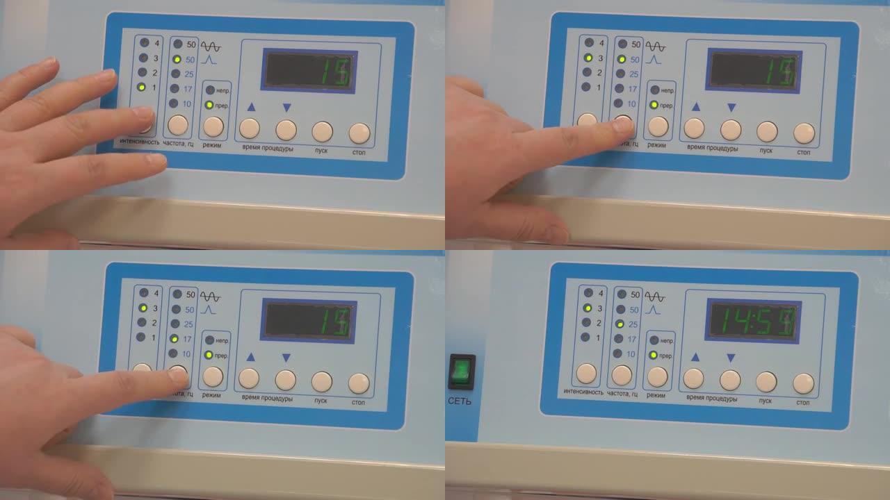 医生的手在医疗设备的仪表板上的特写。医生的特写镜头包括医疗设备。