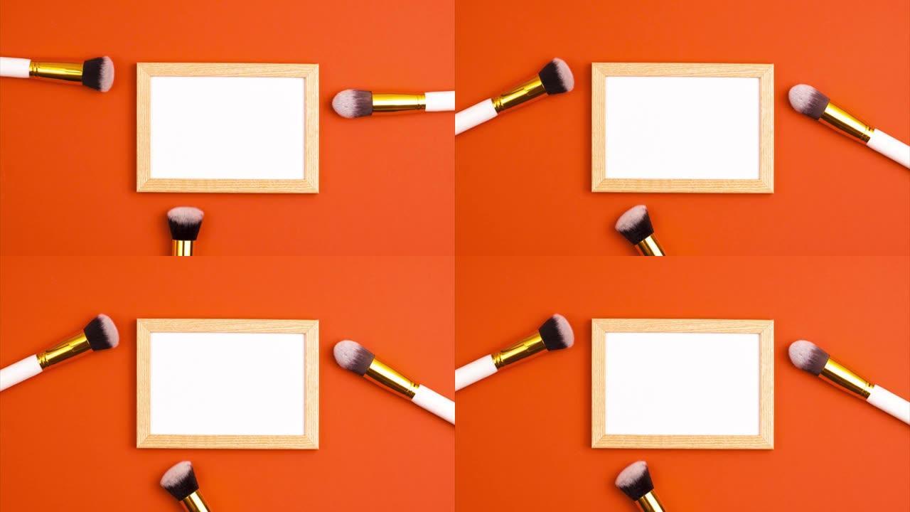 样机木制相框的定格动画在橙色背景上化妆用化妆品画笔的俯视图。化妆品和美容概念模板化妆概念与复制空间平