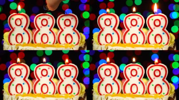 888号生日快乐蛋糕与燃烧的蜡烛顶。