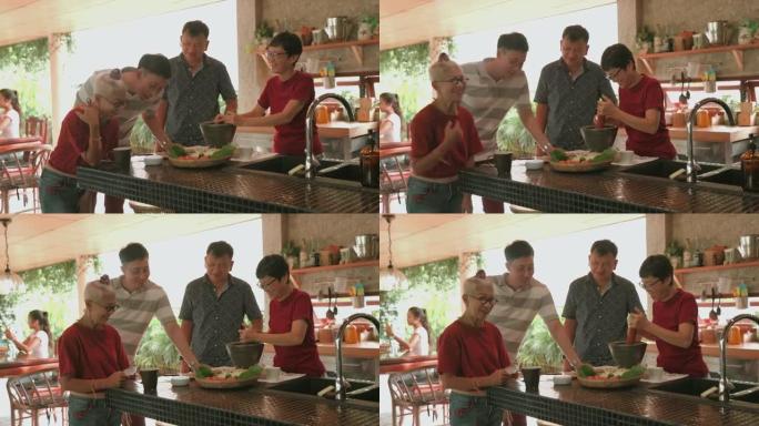 时髦的祖母和儿子与人工智能朋友谈论如何烹饪Somtum-股票视频