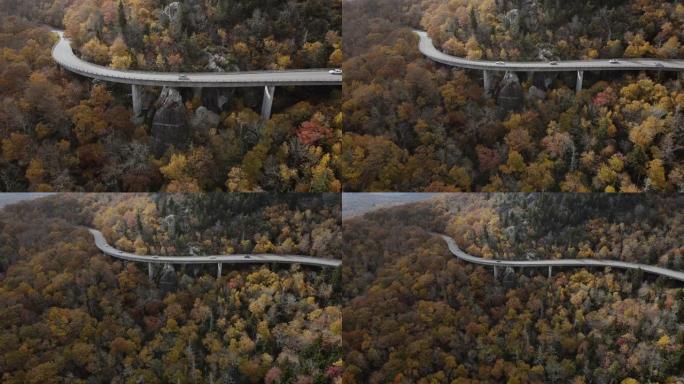 秋天蜿蜒山路的鸟瞰图