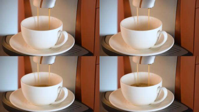 咖啡机将咖啡装满碟子上的白色杯子。