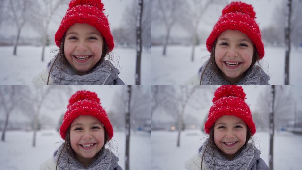 一个可爱的女孩在享受下雪的冬日时无法掩饰自己的兴奋