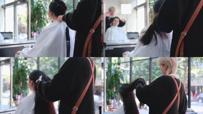 亚洲美容院理发师用白色布套为高加索顾客保护灰尘和脏东西