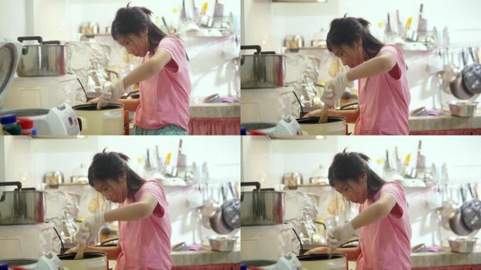 亚洲女孩在家厨房独自烹饪，生活方式理念。