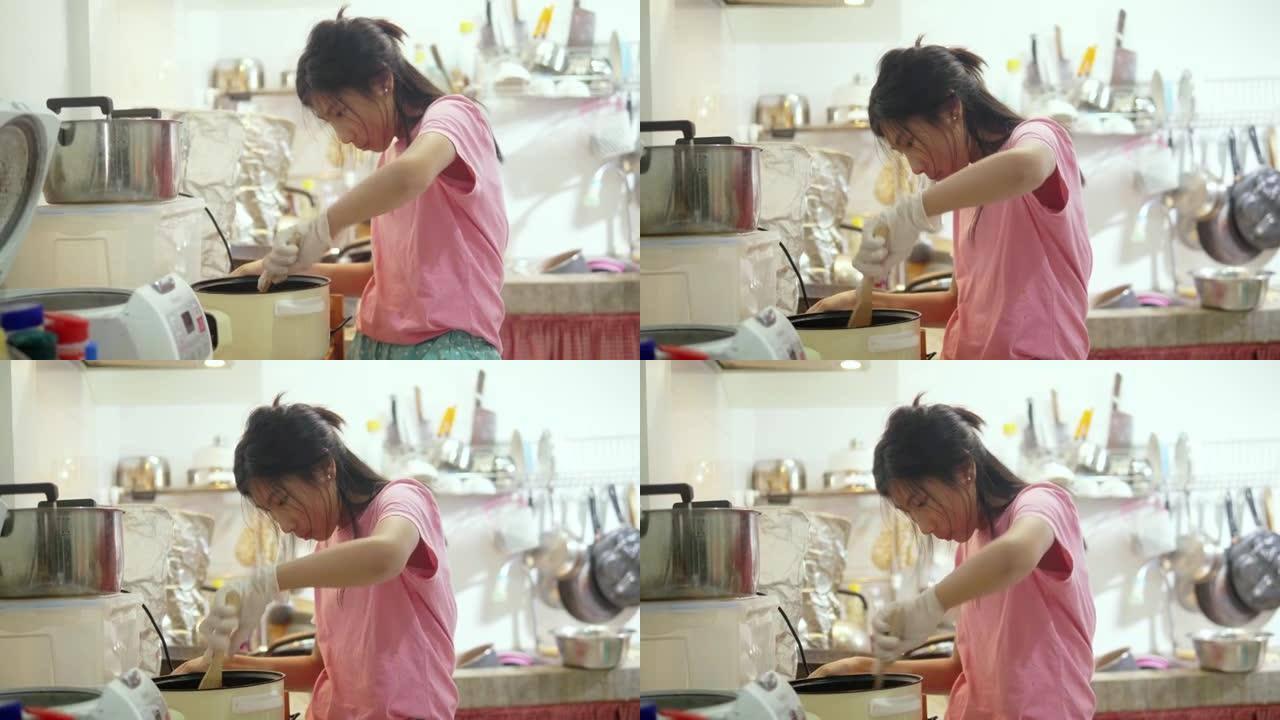 亚洲女孩在家厨房独自烹饪，生活方式理念。