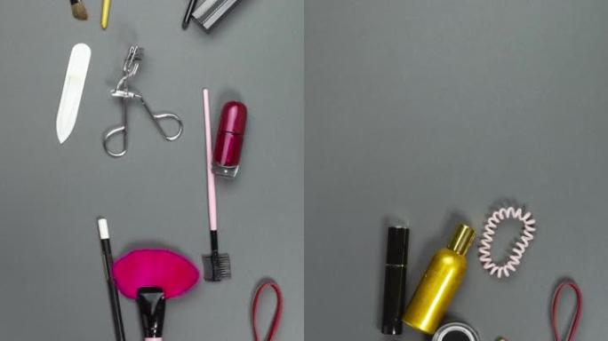 妇女的化妆品和化妆工具飞入一个开放的化妆包。垂直停止运动动画