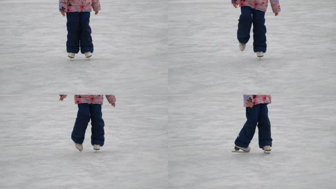 童女在滑冰时尝试技巧