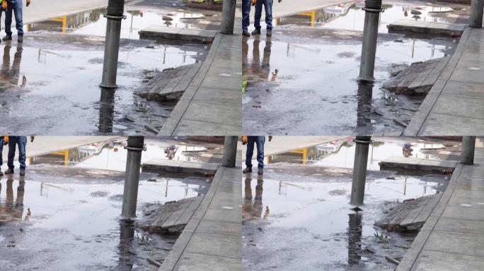 真空卡车软管的特写镜头吸收了从道路上溢出的污水