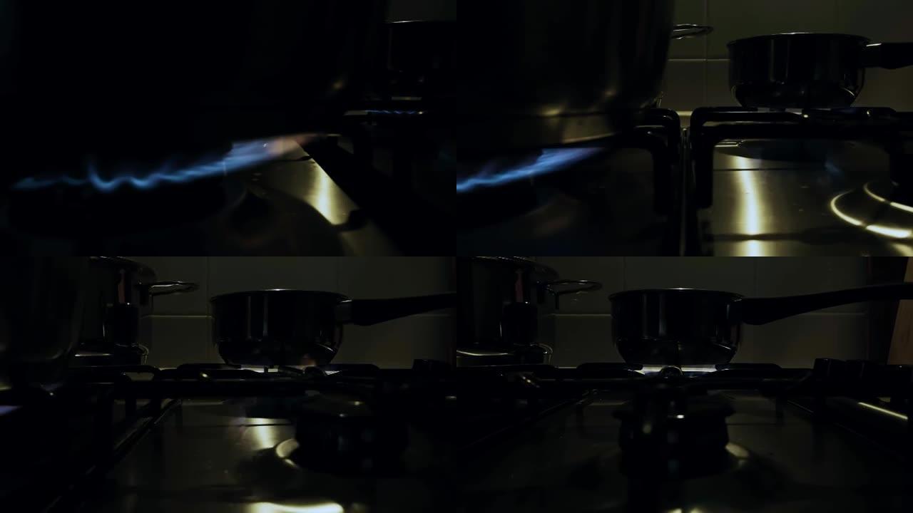 家用厨房炉灶蓝色火焰的特写视图
