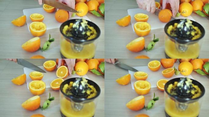男人切成一半新鲜多汁的橘子。榨汁