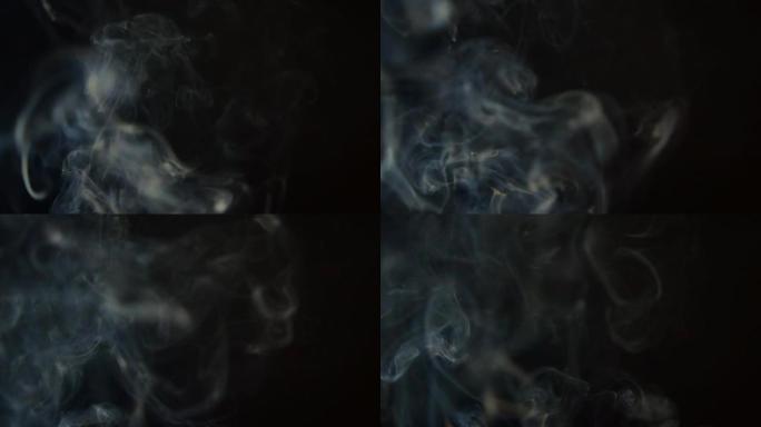 慢动作中的抽象白烟。烟，黑色背景上的一团冷雾，水烟，火。浮雾240