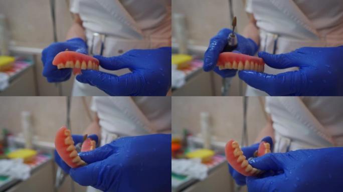 专业的女牙医使用牙钻为患者修复假牙