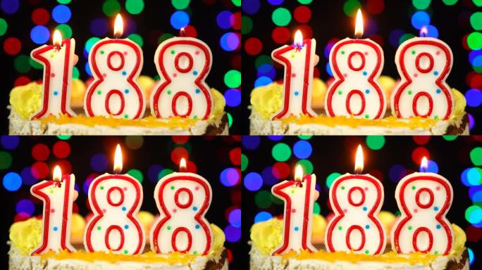 188号生日快乐蛋糕与燃烧的蜡烛顶。