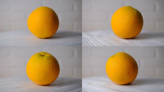 鲜切橙子健康水果的概念在化妆品中也很有用。在白色背景上旋转。