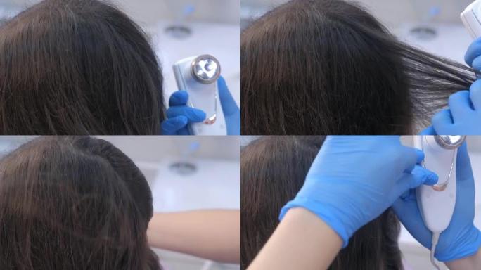医生在临床上使用trichoscope检查女性患者的头发。
