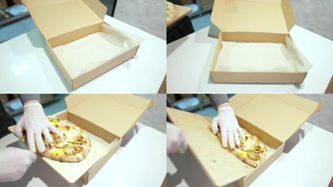 面目全非的厨师把煮熟的比萨饼放在一次性纸盒里。高加索厨师在餐厅厨房准备美味的食物。慢动作