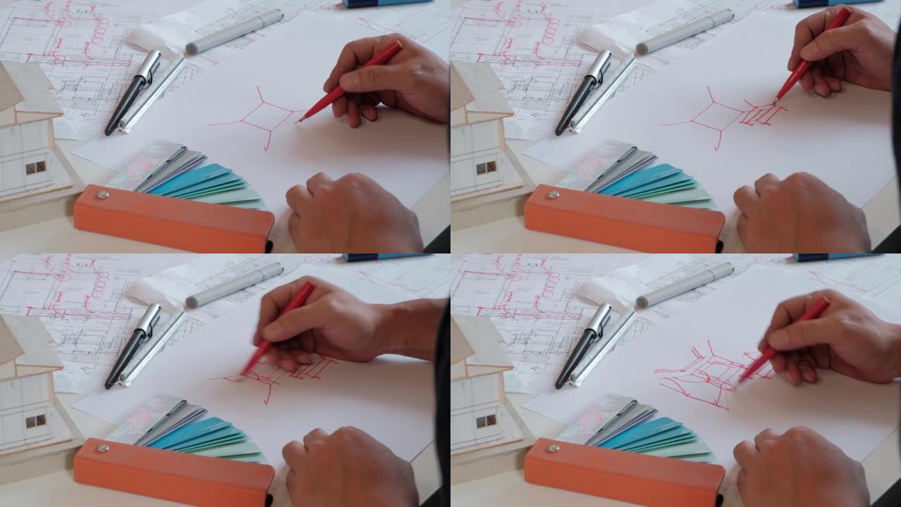 亚洲 (泰国) 设计师正在用他的想象力素描来创作室内设计作品。