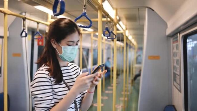 曼谷地铁里戴着医用口罩的曼谷地铁人的亚洲新常态生活。