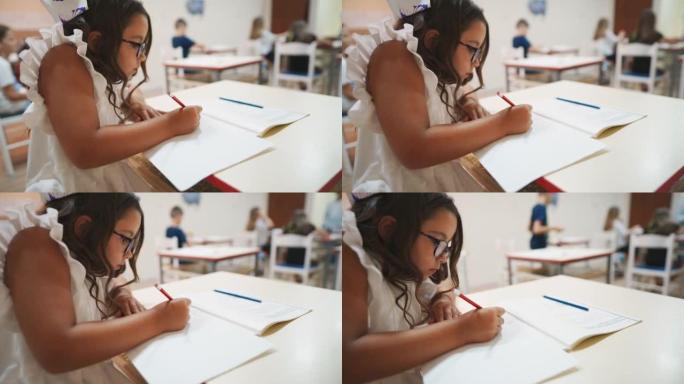 一名女学生在小学美术课上画画