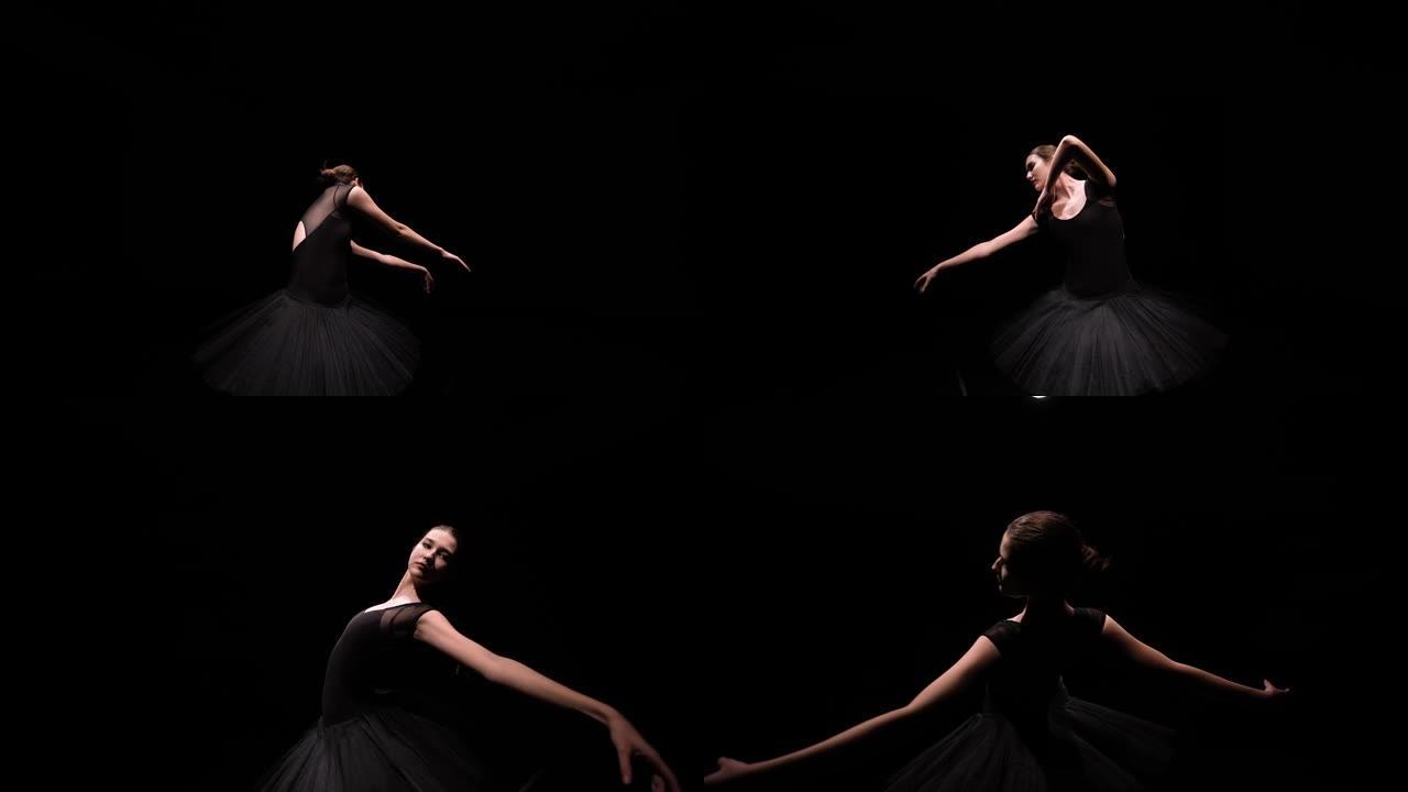 在黑色工作室背景上，黑色天鹅的图像中，芭蕾舞女演员的轨道镜头优雅地移动，并带有背光。特写。慢动作