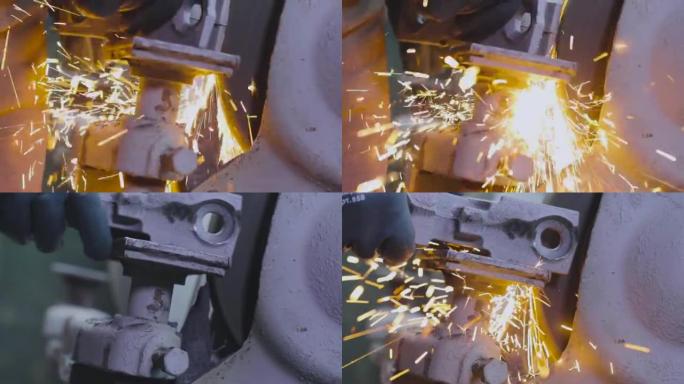 在砂轮特写上加工金属零件。加工金属零件产生的明亮火花。磨削砂轮上的零件产生的火花