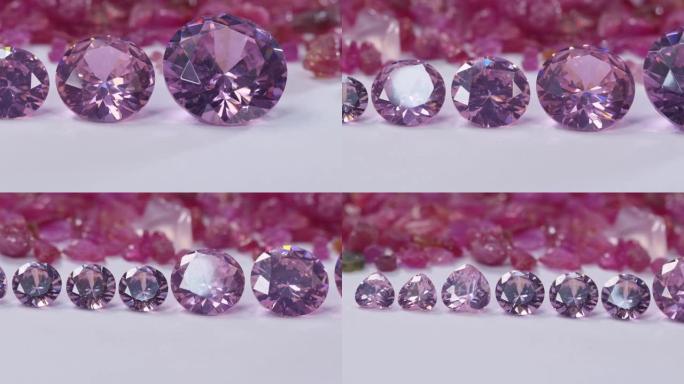白色地面上不同大小的粉色蓝宝石钻石