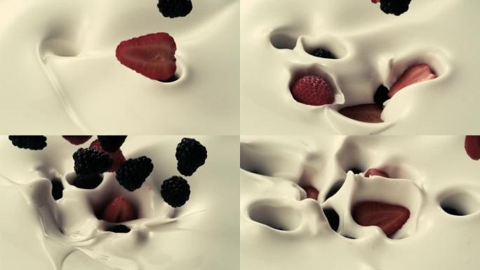 黑莓和草莓以慢动作倒入奶油牛奶中