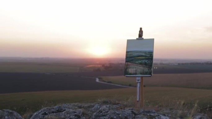 日落时站在乡村画架上的绘画