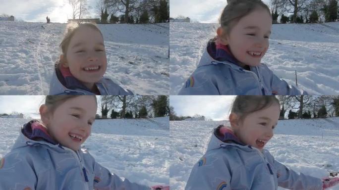 一个年轻女孩在新鲜的雪中滑下雪山的镜头