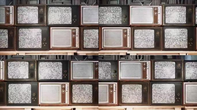 一栋老建筑里的几台老式电视。70年代和80年代的电视，信号接收不良的复古电视。旧桌子上的旧电视。动画