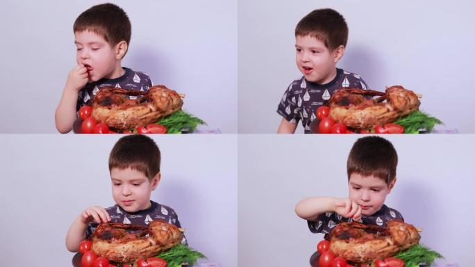 一个3-4岁的男孩吃兔肉。儿童、儿童和肉类的适当营养